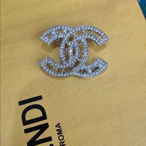 Logo Brooch gold-plated with pearls and crystals